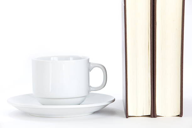istock Composition with books and cup of coffee isolated on white 484310859