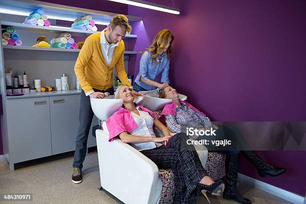 Hairdressers Washing Customers Hair At Hair Salon Stock Photo - Download Image Now - 20-29 Years, 30-39 Years, Adult