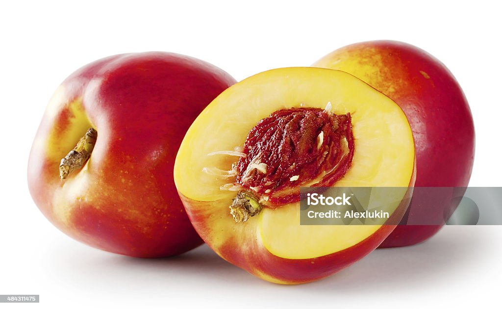 Ripe juicy nectarines Ripe juicy nectarines isolated on white background Cross Section Stock Photo