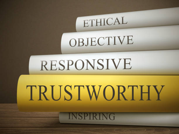 istock book title of trustworthy isolated on a wooden table 484312794