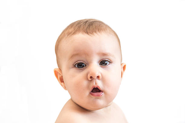 istock confused baby boy portraiture isolated on white 484317432
