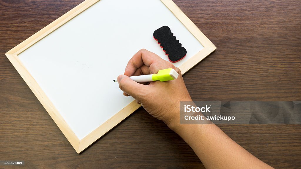 Empty Hand Writing Hand Writing On Empty White Boards On Wooden Surface Stock Photo ...