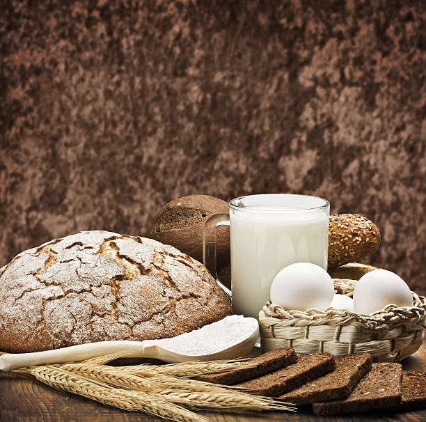 istock assortment of baked bread on wood table 484323915