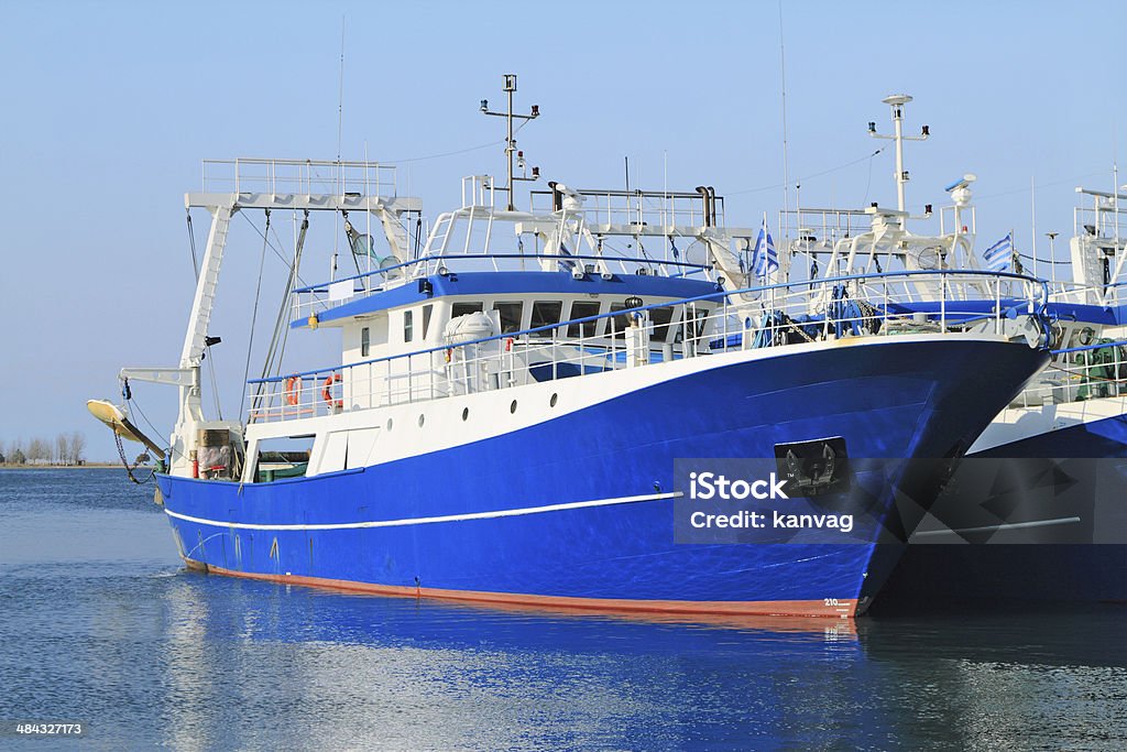 Fishing ships docked in port Modern steel fishing ships docked in port Aegean Sea Stock Photo