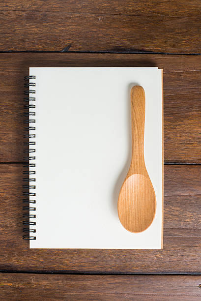 istock Recipe notebook, spoon on wooden background 484327676