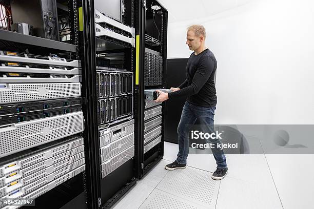 It Professional Install Rack Server In Datacenter Stock Photo - Download Image Now - Adult, Backup, Blade Server