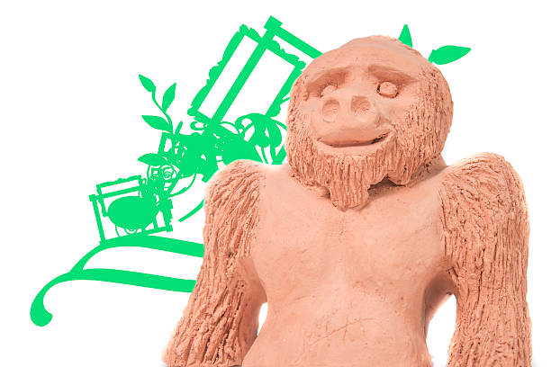 istock clay monkey with green lines on a white background 484328851