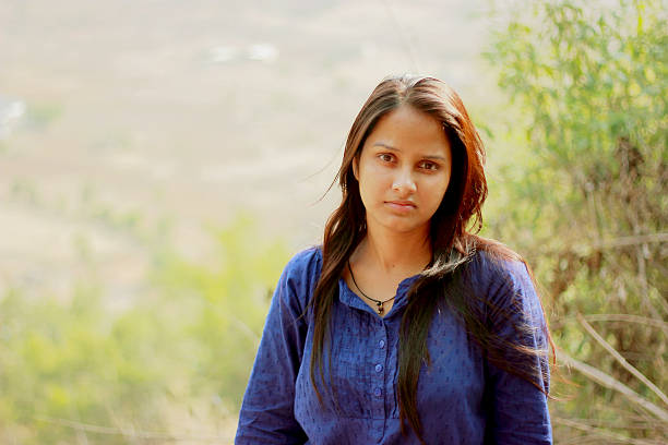 istock Indian woman with blurred natural background 484328868