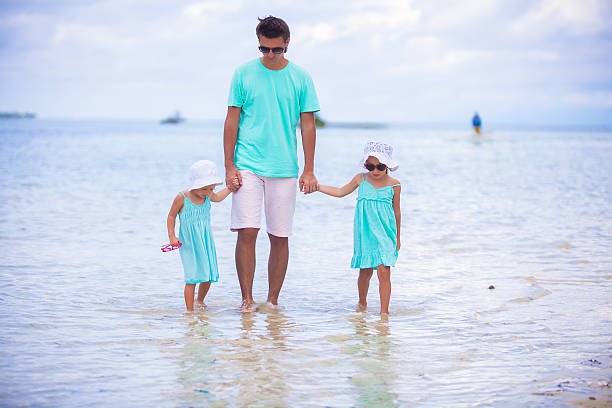 istock Young father and his two adorable daughters on vacation 484328869