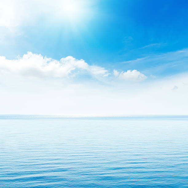 istock sun in blue clouds over sea 484329746