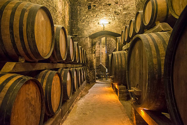 Wine cellars Builing basement with wine barrels. napa county stock pictures, royalty-free photos & images