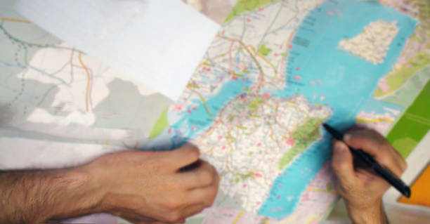 istock Hand Of Young Men Checking Paper Map 484331056