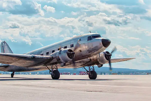 Photo of Dakota Douglas C 47 transport  plane boarded on runway