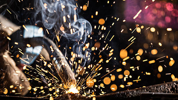 istock Welder in action with bright sparks. 484339104