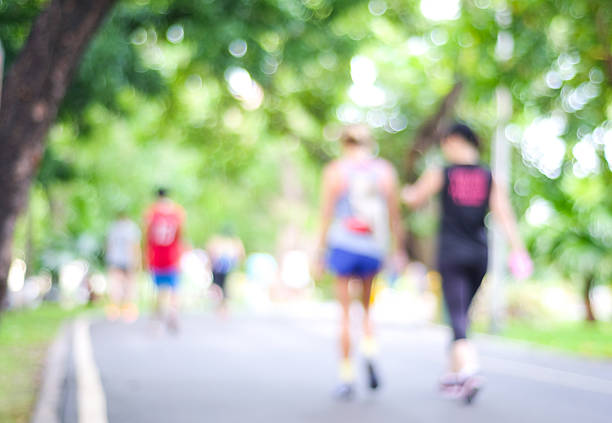 istock Blurred background of people activities in park with bokeh light 484339672