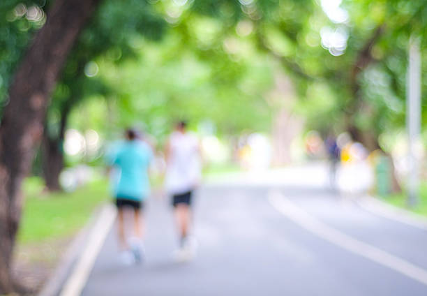istock Blurred background of people activities in park with bokeh light 484339676