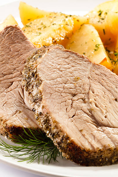 istock Roast meat, baked potatoes and vegetables 484340943