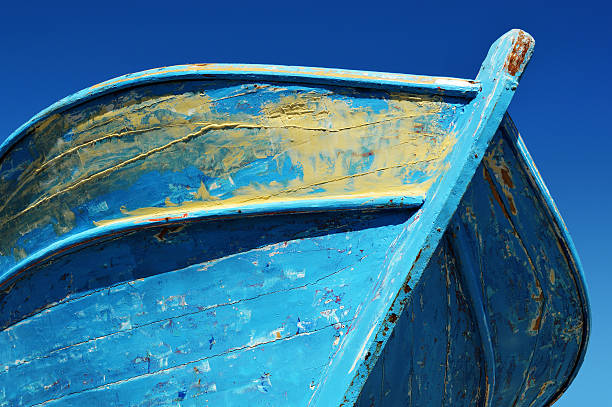 istock Old wooden boat over the blue sky 484342291