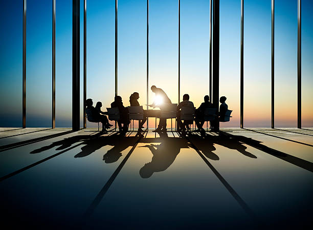Group of Business Having a Meeting during Sunset stock photo