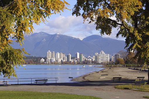 Vancouver, Canada - 2001: A vintage 2000's Canon negative film scan of the cold pacific ocean and Vancouver bay with skyline and mountains in the distance.