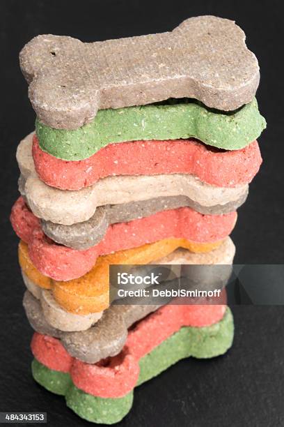 Stack Of Doggie Treats Stock Photo - Download Image Now - Black Background, Chewing, Dog Biscuit