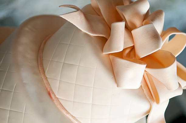 istock Peach Ribbon Frosted Cake 484343565