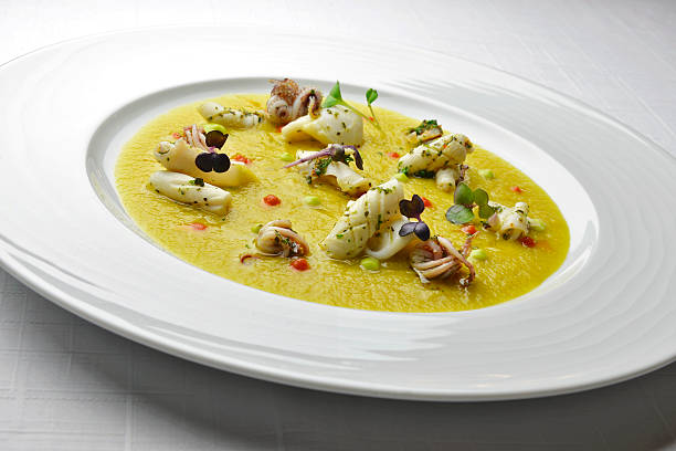 istock Fish Dish Cream with saffron and squid with Herbs 484343566
