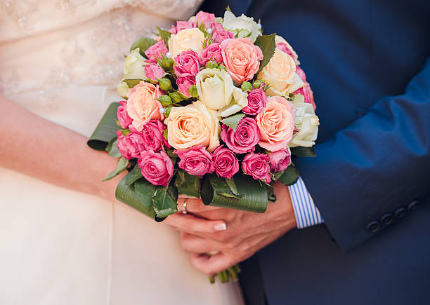 istock bride and the groom showing their rings 484344599