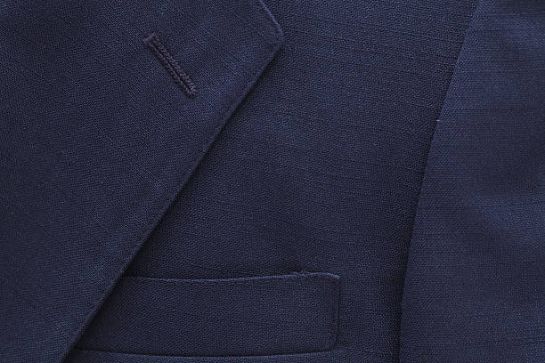 Suit Coat Background Close up view of blue suit coat... blazer jacket stock pictures, royalty-free photos & images