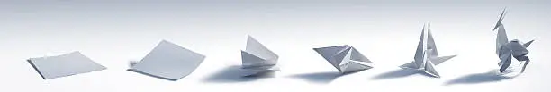 A sequence of an origami antelope being folded by steps.