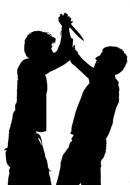 istock Silhouette of an attack with a knife 484345715