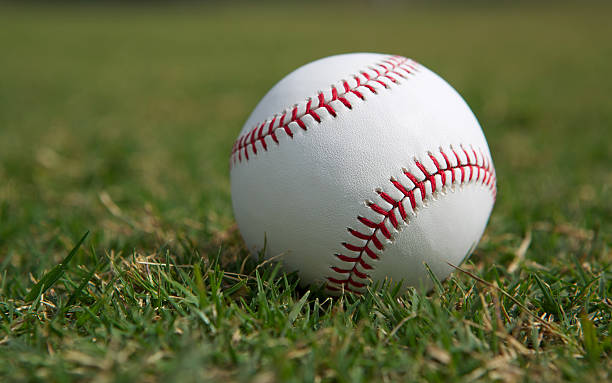 istock Baseball on the Outfield Grass 484346891