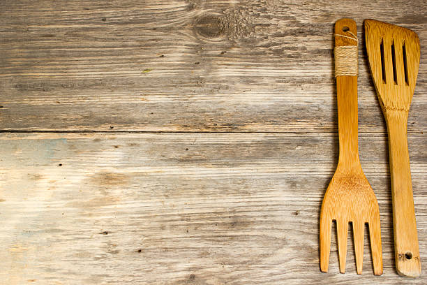 istock wooden cutlery. Copy space to right. 484346892