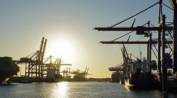 istock sunset in hamburg harbor 484346936