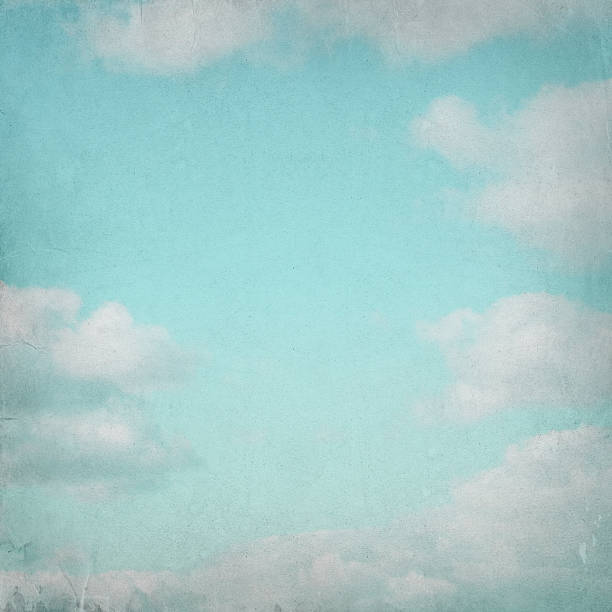 istock Old paper background with blue sky and white clouds 484347224