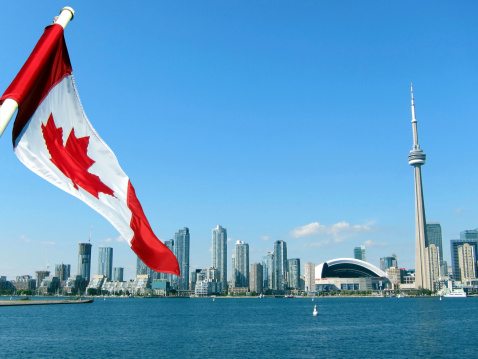 Canada Flag with Toronto, Ontario in the Background