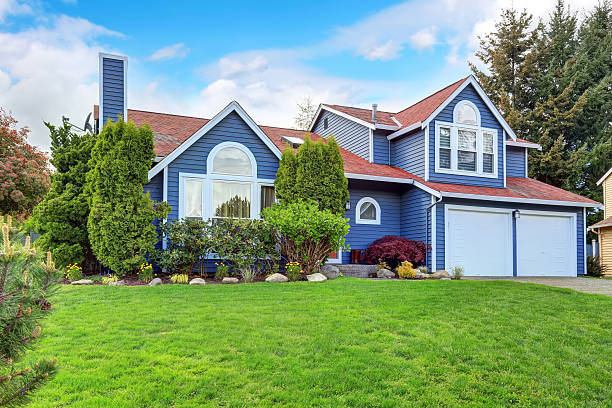 istock Large blue house with white trim and a nice lawn. 484348010