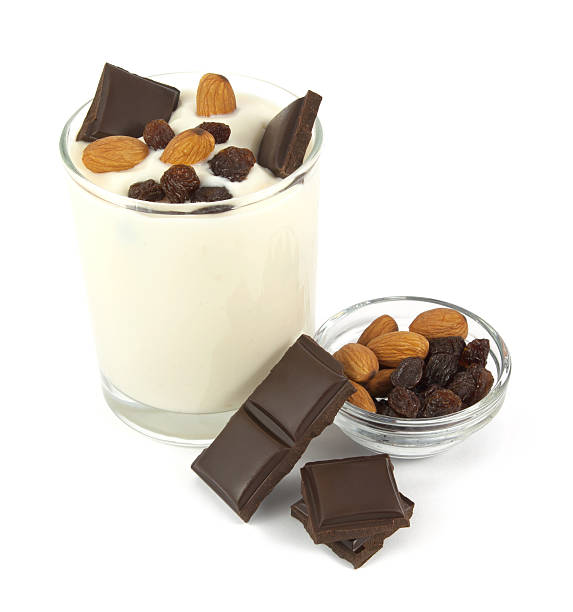 istock Yogurt desert with chocolate, almonds and raisins isolated on white 484348086