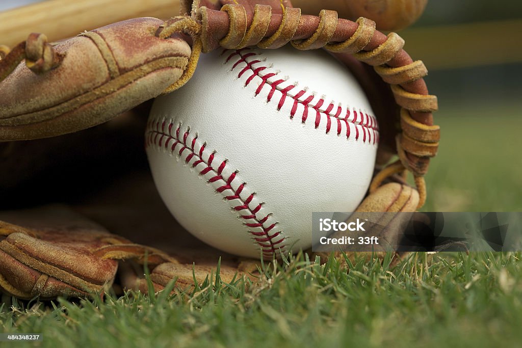 New Baseball in a Glove New Baseball in a Glove in the Outfield Youth Baseball Stock Photo