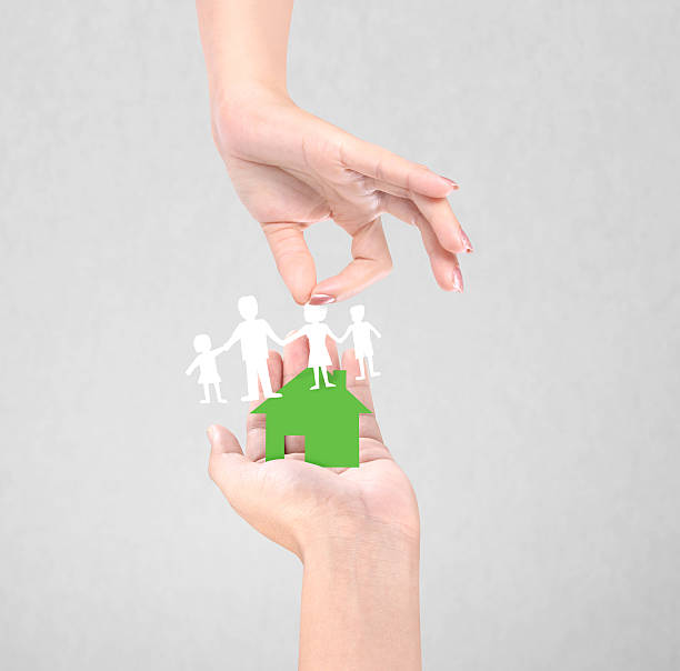 istock paper family in the hand 484348315