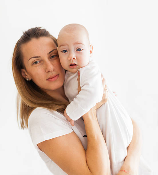 istock Mother holding baby 484348627