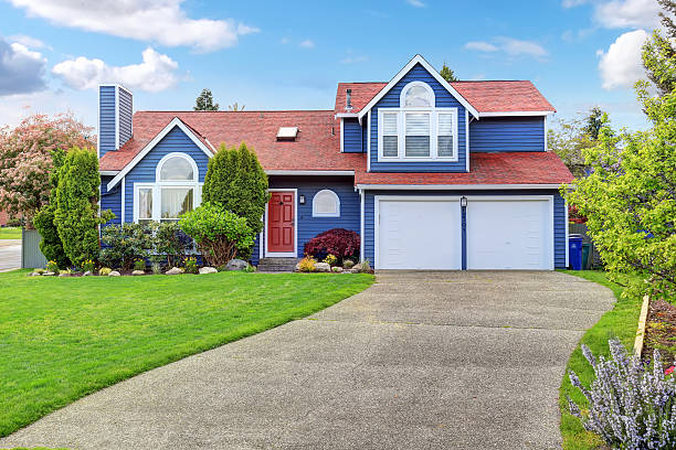 istock Large blue house with white trim and a nice lawn. 484360376