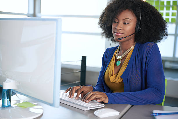 istock Portrait of a smiling customer service representative with an afro 484360406