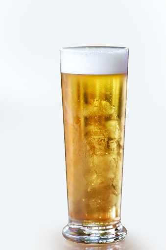 Businessman having a pint of light beer isolated on white background