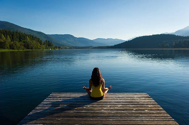 istock Easy Pose Tranquil Lakeside meditation at sunrise 484370062