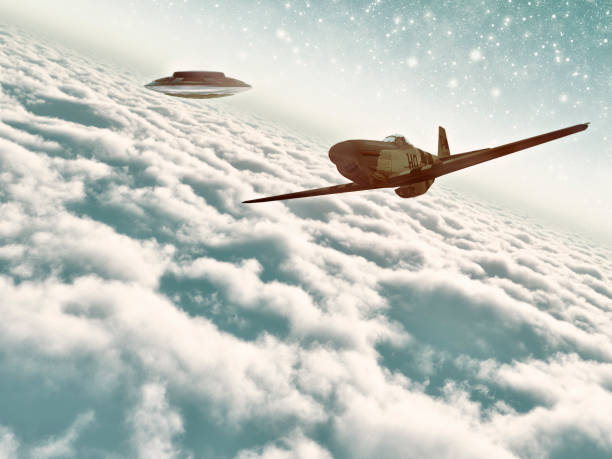 istock UFO following fighter airplane above the clouds 484370370
