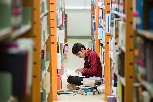 istock Students Asian read the book at the library 484371130