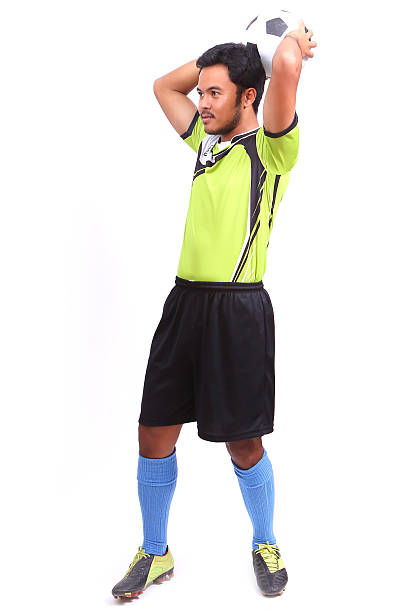 istock Young soccer football player on white 484371857