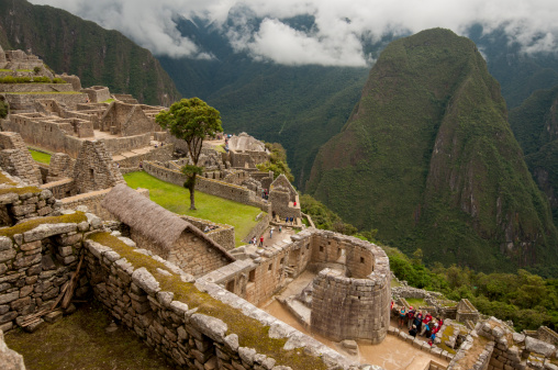 Ruins of Machu Picchu in the clouds, featuring the Temple of the Sun.
