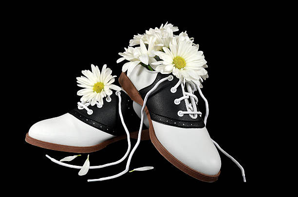istock saddle shoes with daisy bouquet 484374799